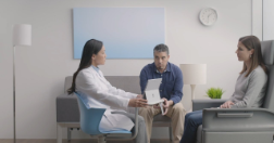 Couple talking with doctor